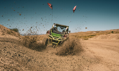 UTV Driving Away on Dirt Trail with American Flags and Flying Dust © Dan
