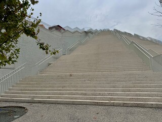 view of the stairs of the Tirana pyramid in the city center on a cloudy summer day
