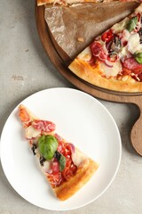 Slice of tasty pizza with thin smoked sausages served on light table, flat lay