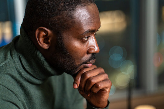 Thoughtful Man Gazing Into Distance