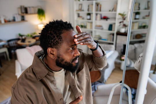Man checking out his appearance in mirror