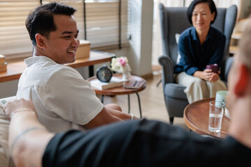 Happy man spending leisure time with family at home
