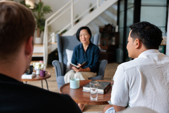 Therapist speaking to married couple