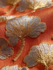 Luxurious embroidery design featuring elegant lotus flowers with shimmering gold threads and silver metallic accents on a warm orange background, creating a refined and artistic oriental textile patte