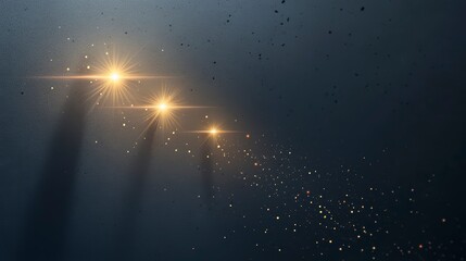 Abstract background with golden light flares, sparkles, and dark shadows.