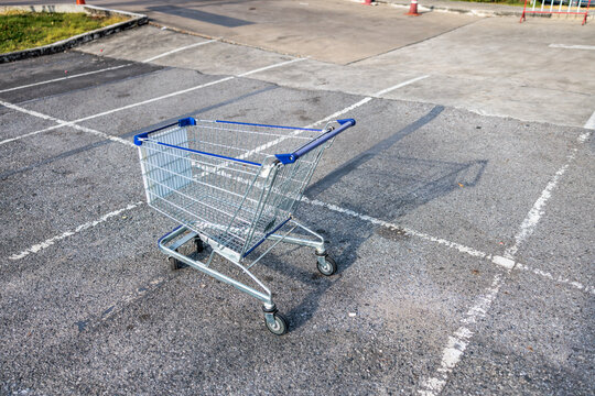 Shopping cart in middle of parking lot