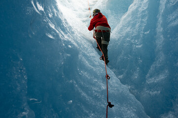 woman exploring majestic ice cavern on a thrilling glacier expedition