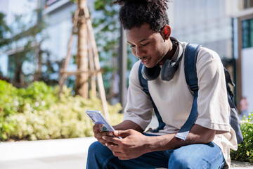 Student checking social media between classes