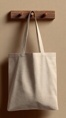 Beige Textured Tote Bag Hanging on Wooden Peg Rail with Cream Wall Background Studio Shot