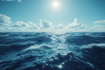 Fototapeta premium Endless blue ocean waves reflect sunlight under a sky filled with fluffy clouds at sunset along the horizon