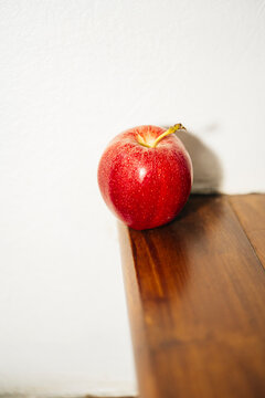 High contrast red apple on stair