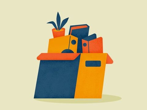 Open cardboard box filled with office supplies