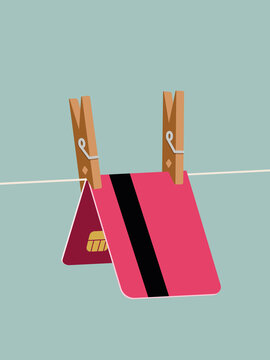 Debit card clipped with wooden pin on line
