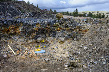 Rockhounding in Central Oregon, thunderegg pit with tools for digging, recreational hobby hunting...