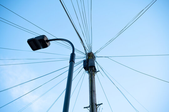 Street lantern and electric lines post
