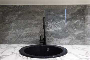 kitchen faucet on a stylish metal sink