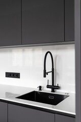 kitchen faucet on a stylish metal sink