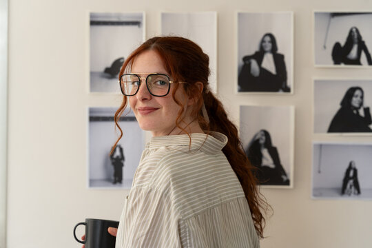 
Photographer with Coffee in Creative Studio