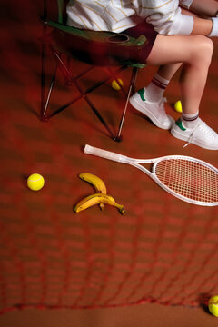 Tennis break with bananas and racket