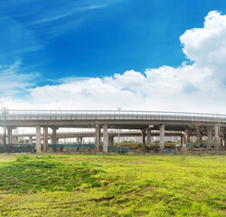 Looking up at a Large Interstate Highway Overpass and Blue Sky