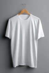 Plain white crew-neck t-shirt hangs on a light wood hanger against a neutral gray background.  It's unblemished and wrinkle-free, showcasing a clean, simple design