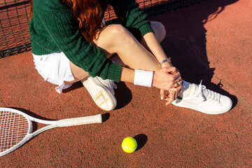Tennis Racket and tennis ball Beside Player

