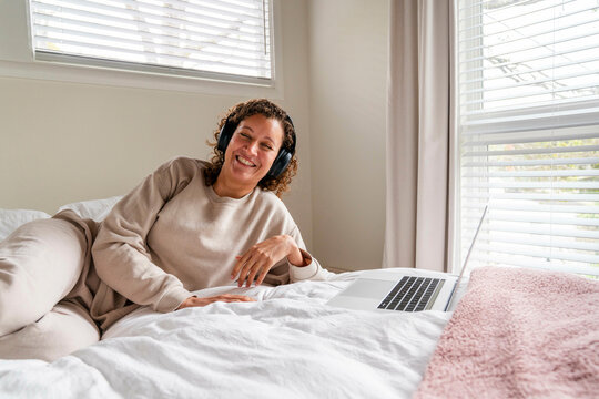 headphones laughing laptop