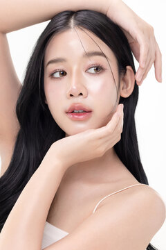 Close up glass skin make up style of beautiful young Asian model isolated on white background.