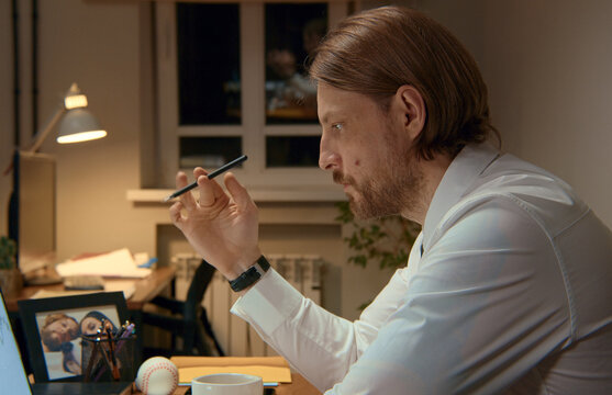 Focused entrepreneur working late at home office developing new ideas