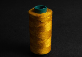golden thread spool isolated