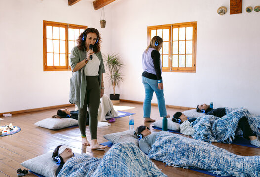 Yoga teacher leading a group session