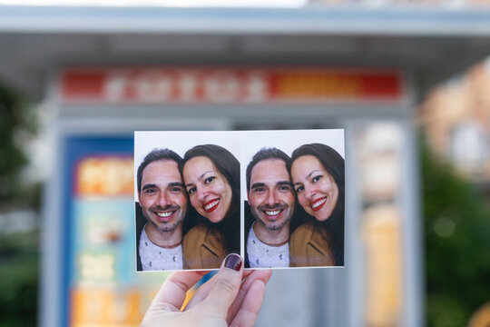 Woman shows photo booth picture