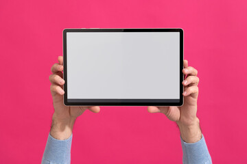 Person holding modern tablet with blank screen. Mock-up. 