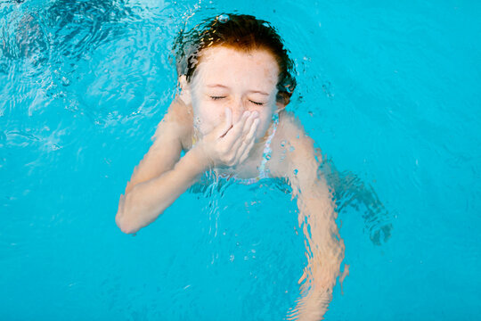 Girl swimming underwater 