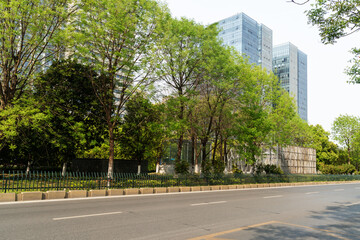 Fototapeta premium Empty urban road and buildings in the city