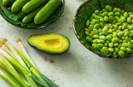 Fresh baby cucumbers, avocado, edamame and spring onions.