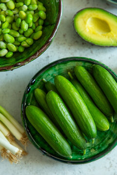 Fresh baby cucumbers, avocado and edamame