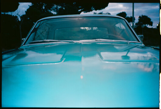 Fototapeta Analog Flash Photo of Classic Blue Car Hood