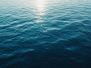 Top view dynamic blue water surface background: Swimming pool ripples blend with ocean waves under sparkling sunlight reflections. Abstract liquid texture for web design, advertising and digital