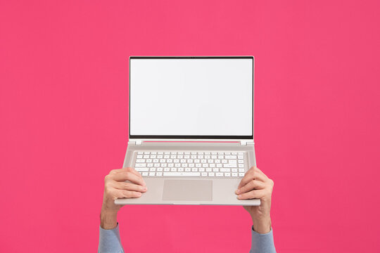 Person holding modern laptop with blank screen. Mock-up. 