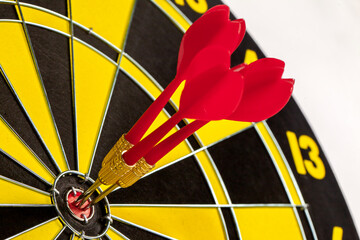Darts arrows on target at the center of the dart board. Concept for success, target achievement,...