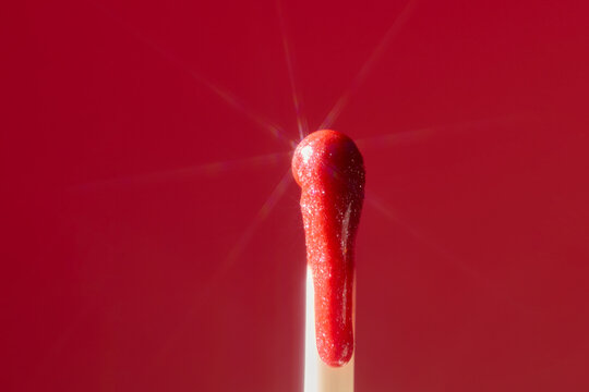 Red drop liquid on applicator. Closeup shot