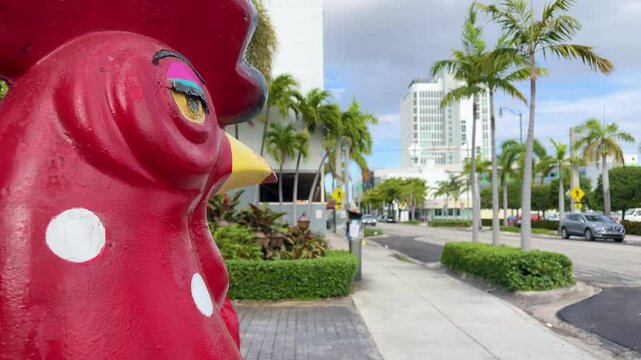 Large, red rooster stands proudly on SW 8th Street in Little Havana, Miami, Florida, a symbol of the vibrant Cuban culture in the neighborhood