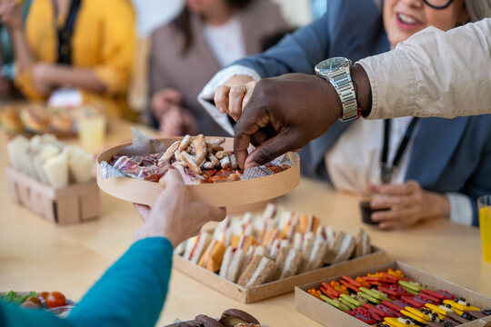 Office lunch gathering with diverse snacks