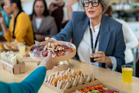 Colleagues enjoying a business meeting buffet