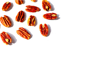 Delicious salted pecan nuts scattered.