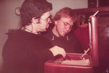 Two friends pretending to be office workers in 1980s style