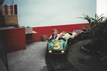 90s childhood fun – girl driving a go-kart