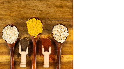 A Colorful Collection of Various Spices Displayed Tastefully on Elegant Wooden Spoons