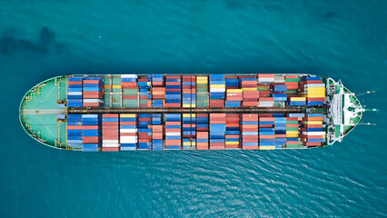 Aerial view of Large cargo ship with port area.Shipping logistics with sea freight indutry.Global import and export.T